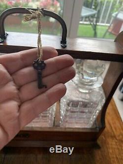 3 Cut Glass Decanters In An Oak Tantalus With Lock And Original Key