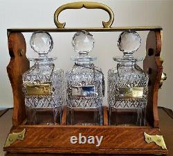 ANTIQUE TANTALUS WITH 3 GLASS DECANTERS by Betjemann