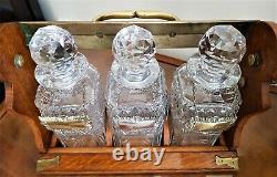 ANTIQUE TANTALUS WITH 3 GLASS DECANTERS by Betjemann