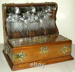 A LATE VICTORIAN OAK TANTALUS 3 Decanters Gothic Brass Mounts, Collectable