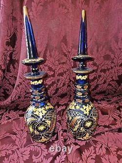 A PAIR OF BOHEMIAN CUT AND ENAMELLED BLUE GLASS DECANTERS AND STOPPERS. 19th Cen