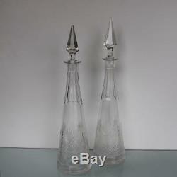 A pair of antique glass Cristal diamond point cut wine decanters