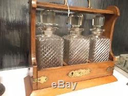 Antique Oak & Brass Tantalus With Three blown and hand cut glass decanter