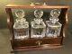 Antique Oak Tantalus With Three Lead Crystal Decanters & Key