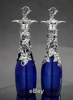 Antique cobalt Bristol blue glass 2 wine decanters silver plate grapevine top