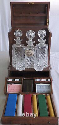 Antique mahogany Tantalus games box Three decanters and 4 hobnail cut glasses