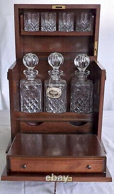 Antique mahogany Tantalus games box Three decanters and 4 hobnail cut glasses