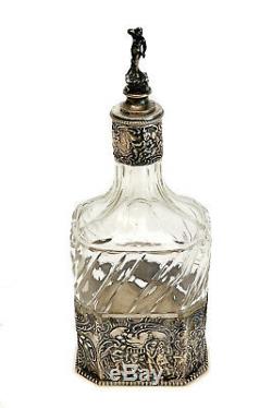 Dutch Silver & Cut Glass Wine Decanter, circa 1900. Figural Scenes
