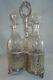 English Silver Tantalus Set With 3 Cut Crystal Decanters