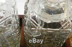 English Three Bottle Locking Tantalus. Oak Wood Frame and Cut Glass Bottles