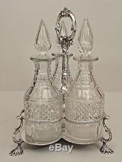 English Victorian Silverplate Tantalus Set with 3 Cut Crystal Decanters