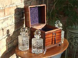 Georgian Mahogany tantalus with four cut glass decanters- lockable with handles