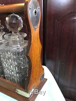 Oak Tilt Bar Tantalus/Decanter Stand With 3 Hobnail Cut Decanters And Key