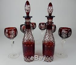 Pair of Matching Cranberry Cut clear crystal decanters 14 inches with 6 glasses