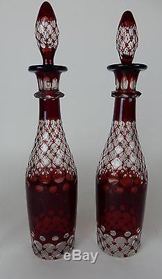 Pair of Matching Cranberry Cut clear crystal decanters 14 inches with 6 glasses