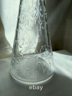 Saint Louis vintage crystal decanter. Cut vines around conical body. 13 1/2 h