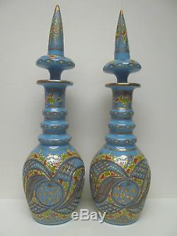 TWO BOHEMIAN TURQUOISE CUT AND ENAMELLED OPALINE/GLASS DECANTERS AND STOPPERS