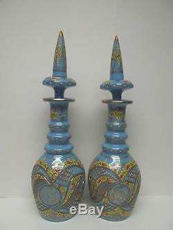 TWO BOHEMIAN TURQUOISE CUT AND ENAMELLED OPALINE/GLASS DECANTERS AND STOPPERS