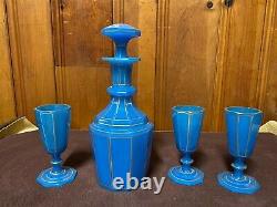 Translucent 4 piece set with decanter & 3 cups of gilded cut blue opaline glass