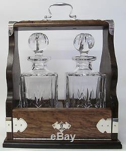 Two Decanter Tantalus In Solid Oak Frame With Silver Plated Fittings