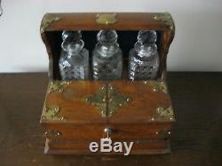 Victorian oak three cut glass decanters gaming tantalus with brass mounts