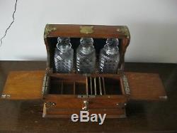 Victorian oak three cut glass decanters gaming tantalus with brass mounts